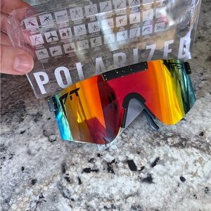 Pit Viper Polarized Shield Sunglasses in Red-Orange Gradient with Blue Accents